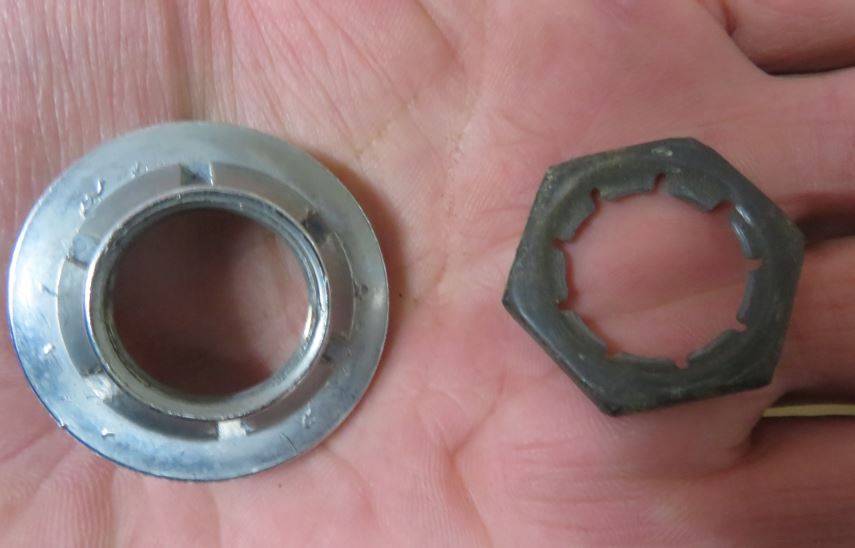Attached picture mirror remote cable retainer stamped steel nut.JPG